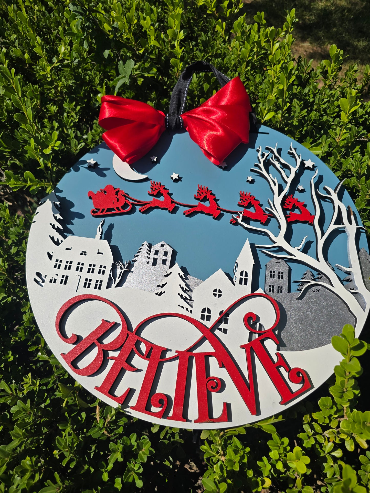 “Believe” Christmas Wall Sign – Santa’s Sleigh Over Winter Town